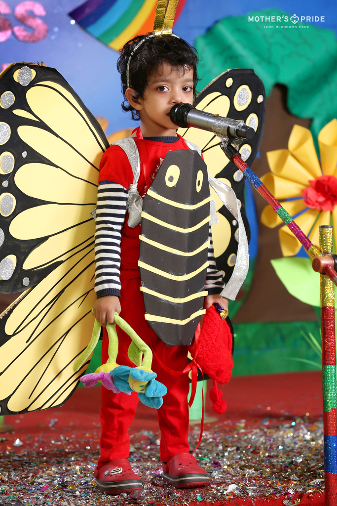 South Asian Indian girl dressed as butterfly performing fancy dress  competition on stage in nursery school MR | Dinodia Photo Library